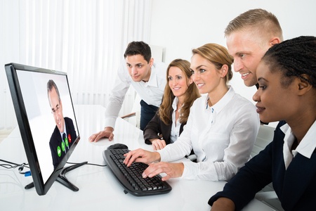 image of people reviewing  a program